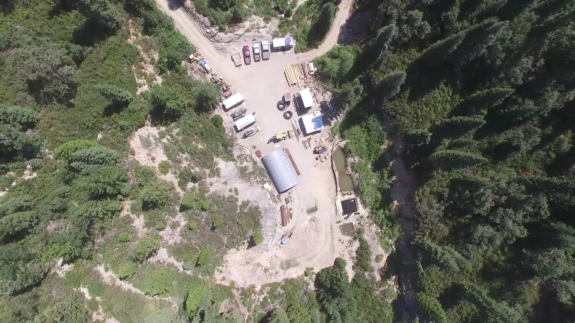 Oblique aerial image of the mine site in the forest.